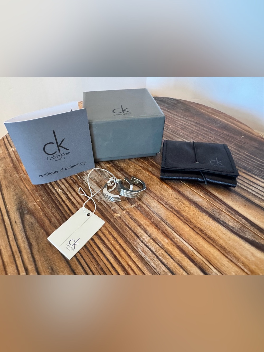 NWT Calvin Klein Geometric Silver Earrings Half hoop Stainless Steel.